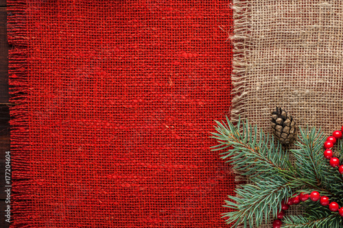 christmas decorated red burlap tablecloth background top view