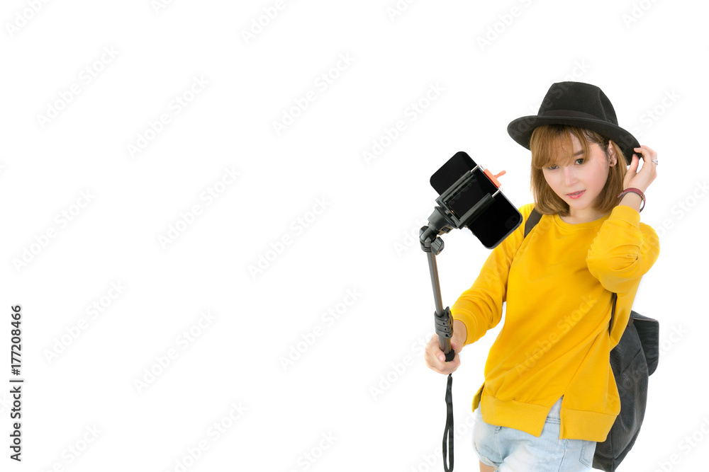 Portrait of asian woman takes a selfies with monopod isolated on white background.Free form copy space. Portrait of asian woman takes a selfies with monopod isolated on white background.Free form copy space.