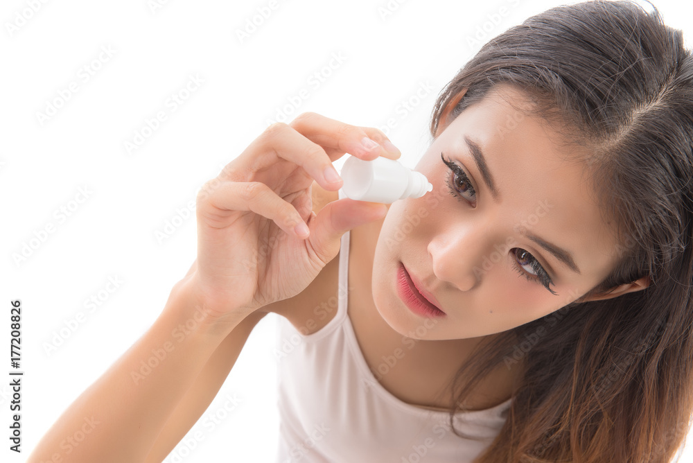 woman getting the medicine in the eye.Young woman applying eye drops isolated on white background. Health care concept. woman getting the medicine in the eye.Young woman applying eye drops isolated on white background. Health care concept.