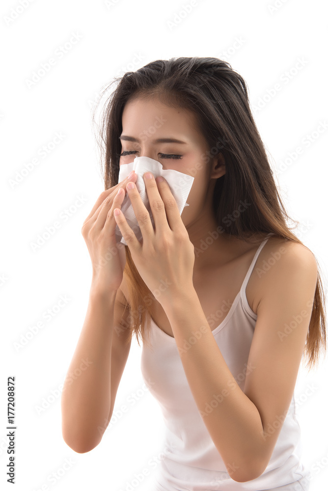 Flu cold or allergy symptom. Sick young woman girl sneezing in tissue isolated on white background. Asian woman use of the tissue. Health care concept. Studio shot. Flu cold or allergy symptom. Sick young woman girl sneezing in tissue isolated on white background. Asian woman use of the tissue. Health care concept. Studio shot.