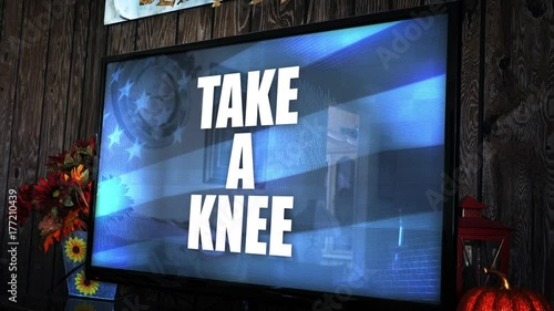 TV with ominious controversial news headline - Take a Knee photo