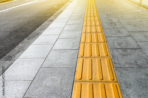 tactile paving for blind handicap on tiles pathway, walkway for blindness people.