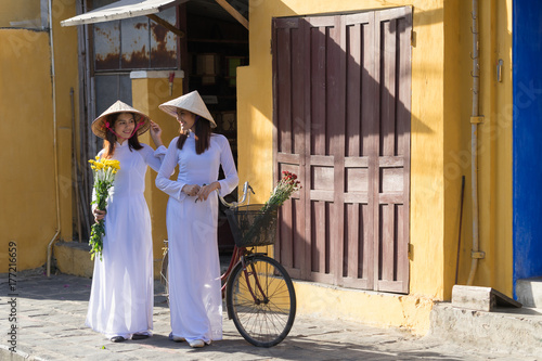Beautiful woman with Vietnam culture traditional dress,Ao dai is famous traditional costume ,vintage style,Hoi an Vietnam
