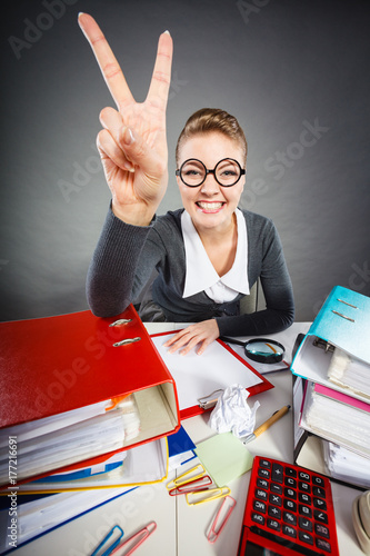 Happy satisfied businesswoman in office.