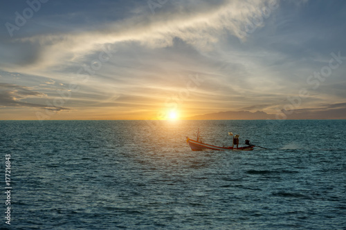Small fishing boat in the sea. © noppharat