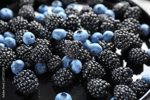 Closeup of blackberries and blueberries on plate © Africa Studio