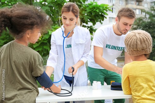 Volunteer doctor measuring ...