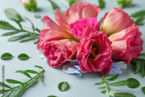 Beautiful composition with flowers on light background