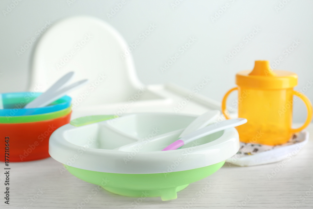 Bright baby dishware on table Bright baby dishware on table