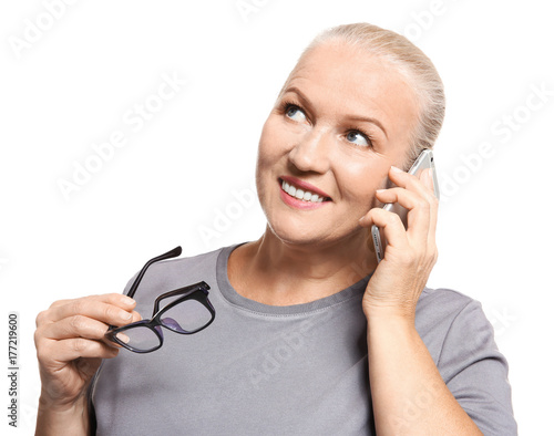 Senior woman speaking on ce...