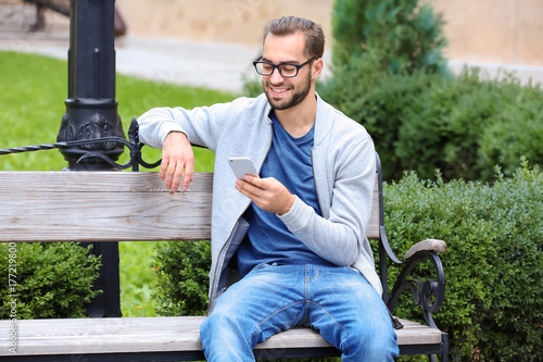 Attractive young man sittin...