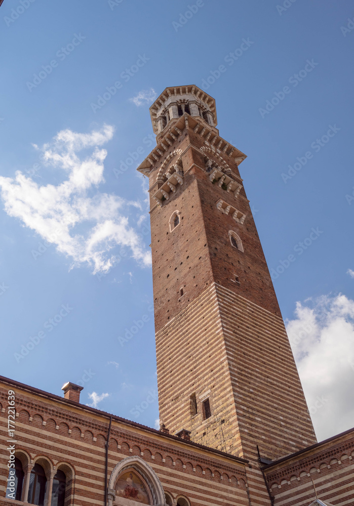 Lamberti tower in Verona Italy. Shooted in a september noon with blue sky and white cloud