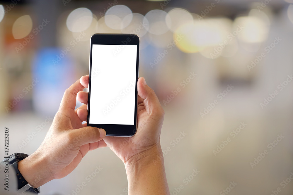 Mockup smartphone blank screen in man hands over blurred background. Mockup smartphone blank screen in man hands over blurred background.