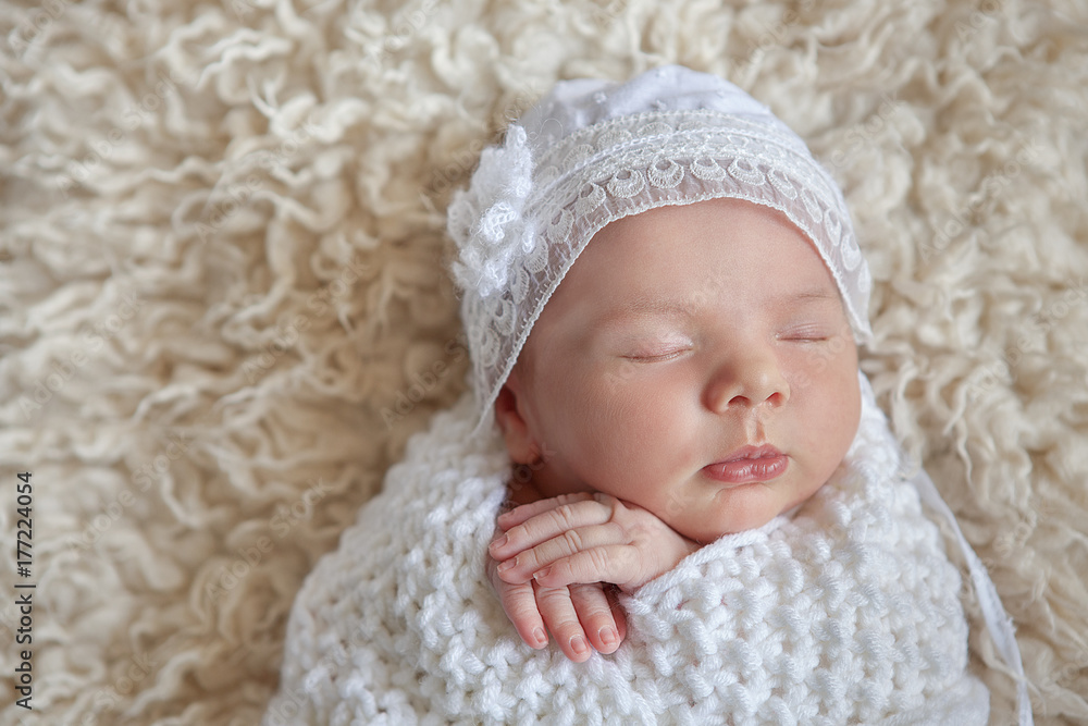 Amazing newborn baby sleeping beauty enjoying first days in her his life in luxury tender clothes and blankets made by couturier Amazing newborn baby sleeping beauty enjoying first days in her his life in luxury tender clothes and blankets made by couturier