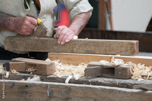 Asti, Italy - September 10, 2017: carpenter works wood with its tools