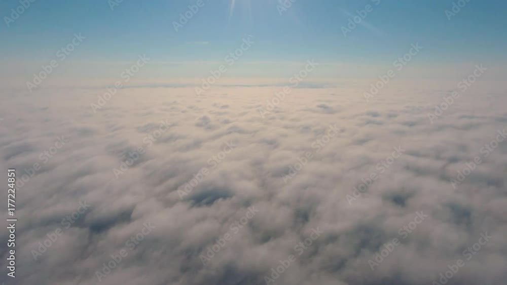 Aerial View. Flying in fog, fly in mist. Aerial camera shot. Flight above the clouds towards the sun. Misty weather, view from above. Aerial View. Flying in fog, fly in mist. Aerial camera shot. Flight above the clouds towards the sun. Misty weather, view from above.