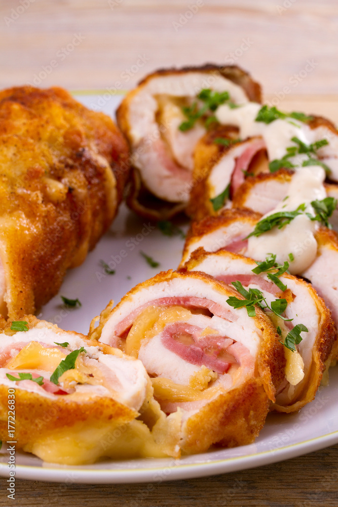 Chicken breasts with cheese and bacon. Crispy, creamy chicken wraps, horizontal Chicken breasts with cheese and bacon. Crispy, creamy chicken wraps, horizontal
