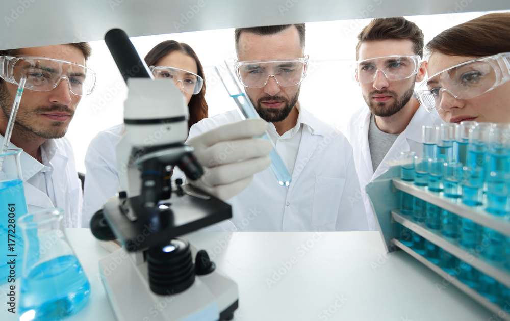 group of pharmacists working in the laboratory. group of pharmacists working in the laboratory.