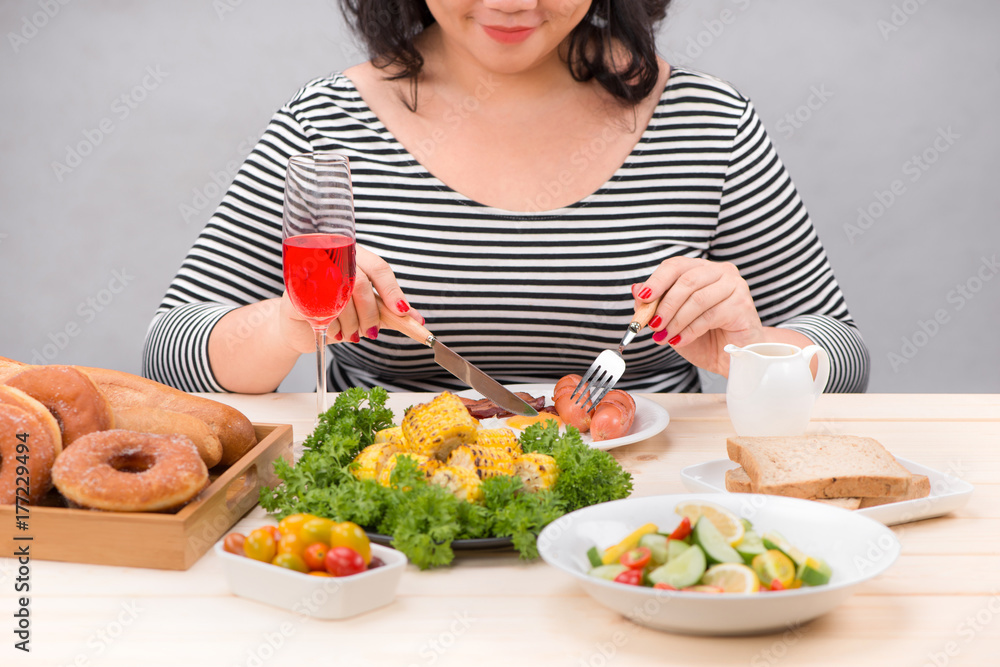Cropped image of asian woman have breakfast Cropped image of asian woman have breakfast