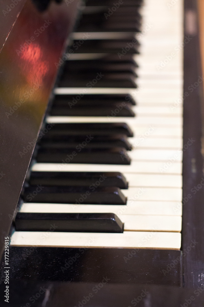 Piano keys side view with shallow depth of field . Piano keys side view with shallow depth of field .