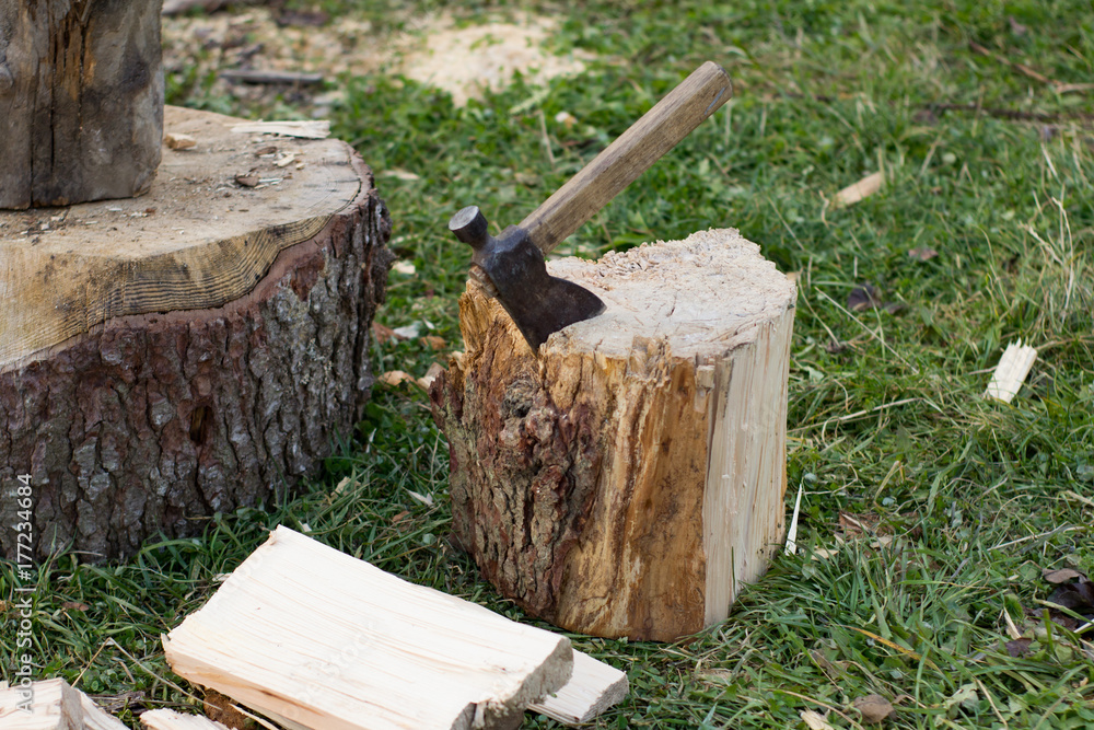 Close up piture of chopping firewood, country photo with wood and axe Close up piture of chopping firewood, country photo with wood and axe