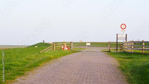 maintenance road entrance dutch sea dike photo