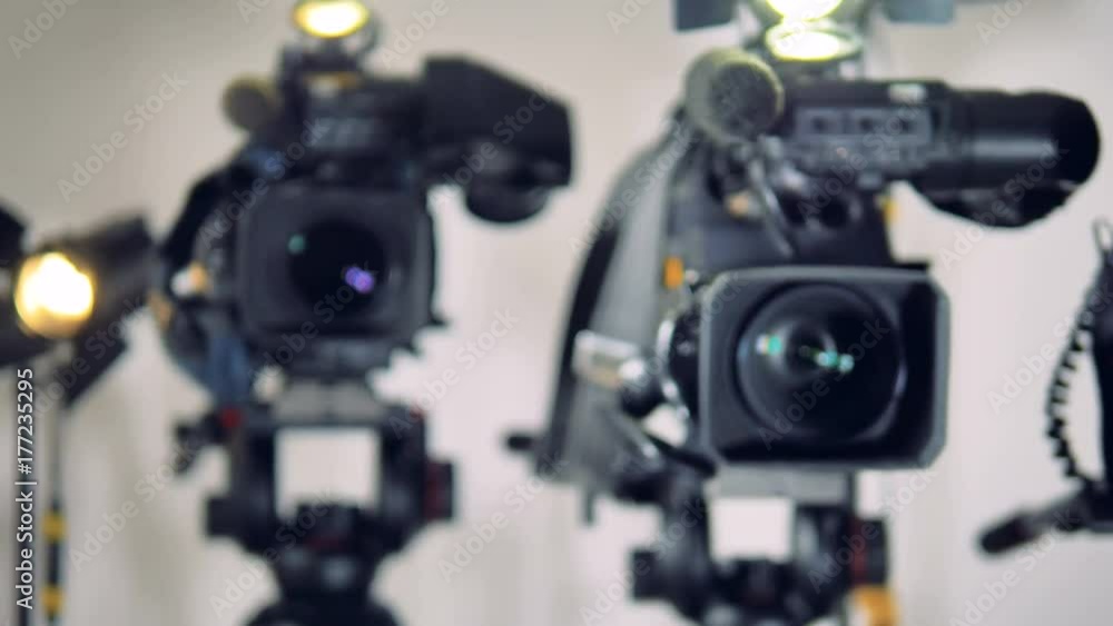 Three video cameras with only one in focus. 