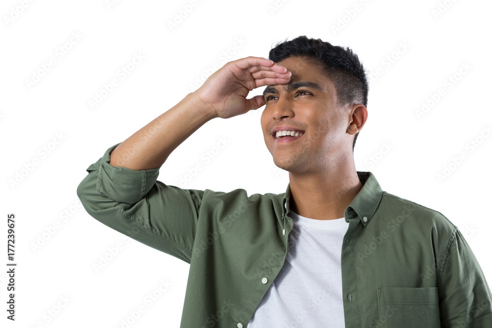 Man shielding eyes against white background Man shielding eyes against white background