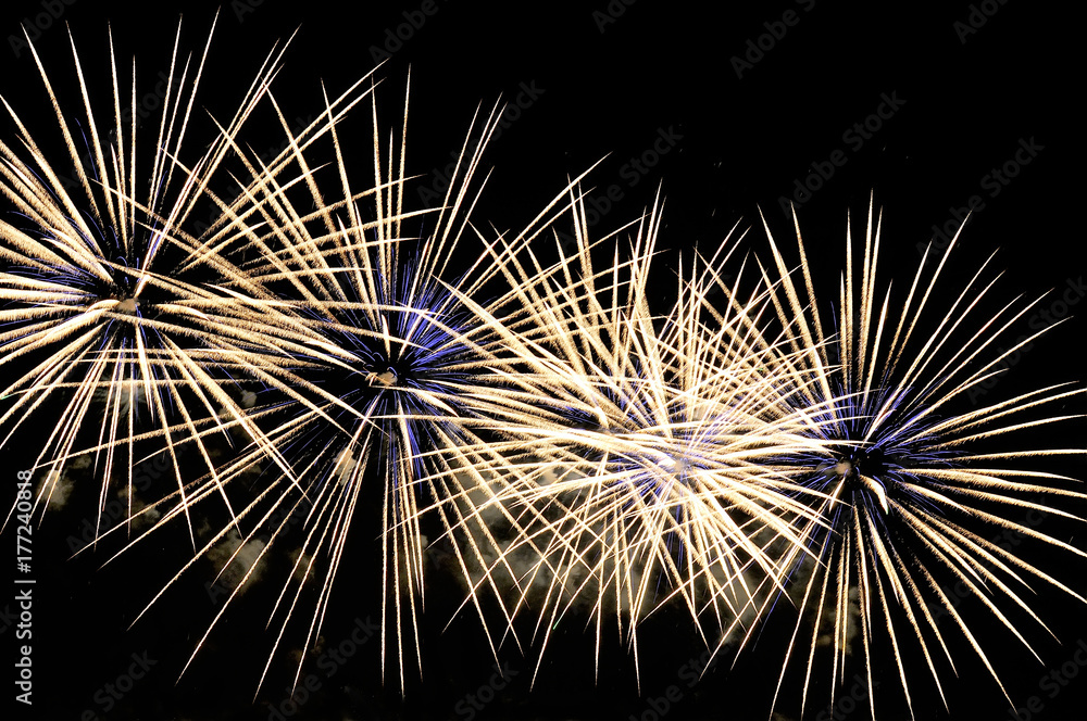 Obraz premium Amazing white-blue fireworks on black background
