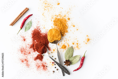 Fototapeta Naklejka Na Ścianę i Meble -  spoons with paprika and curry