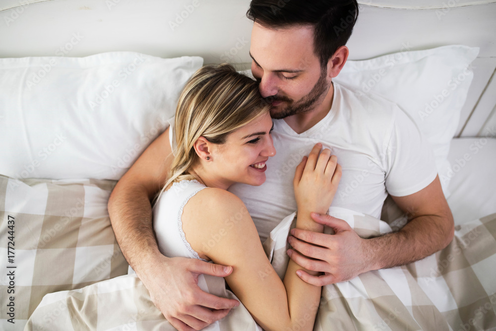 Beautiful woman and attractive man lying on bed Beautiful woman and attractive man lying on bed