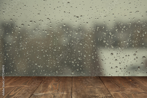 Fotografie Table on rainy window background
