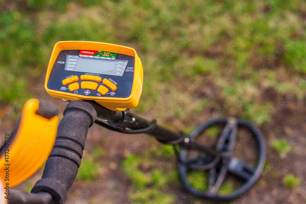 Search for treasure using a metal detector Search for treasure using a metal detector