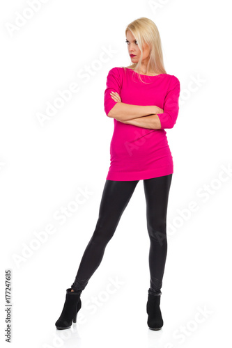 Serious Beautiful Blond Woman Is Standing With Arms Crossed And Watching © studioloco