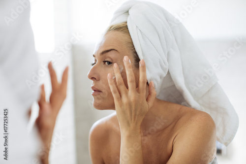 Woman Applying Moisturising Creme on Her Face