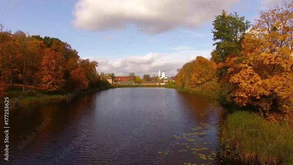 Aerial view of the lake against the temple on the background, Bagrationovsk, Russia, autumn time Aerial view of the lake against the temple on the background, Bagrationovsk, Russia, autumn time