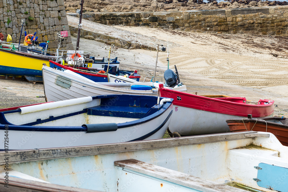Small colourful fishing boats on a quayside