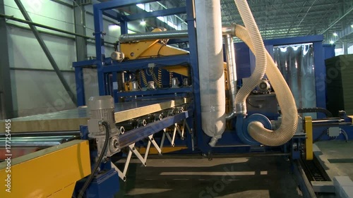 Sandwich panel producing machine at work