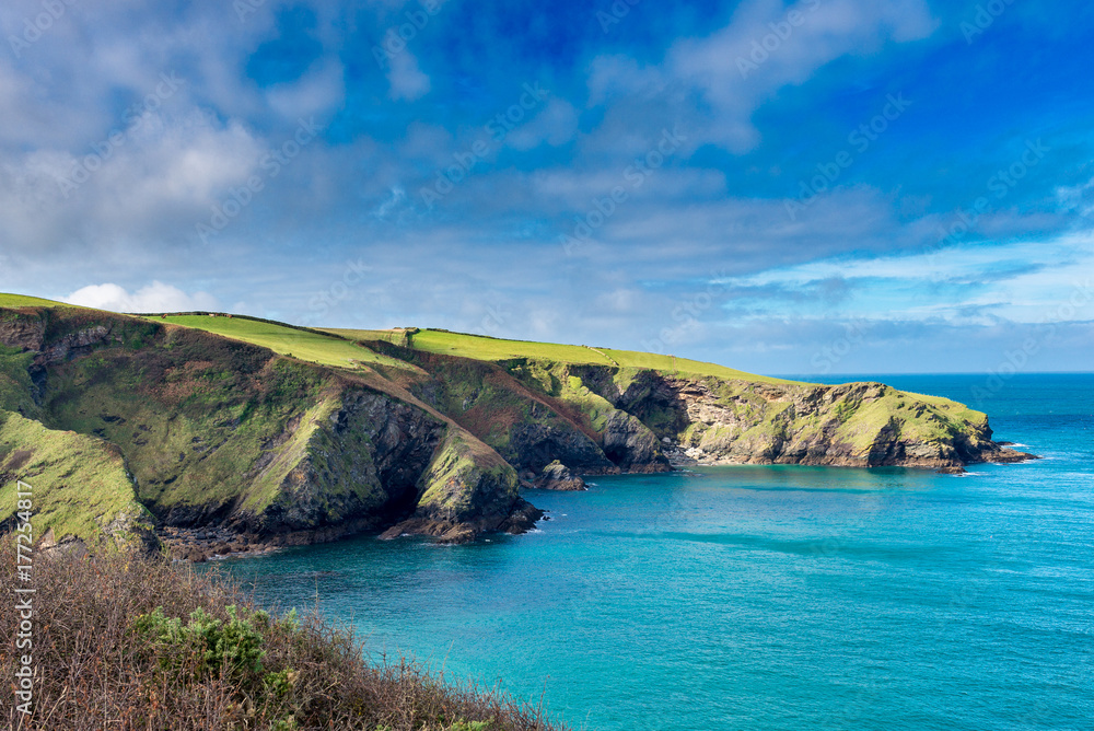 Sunlight catches the headland close to the pretty village of Port Isaac