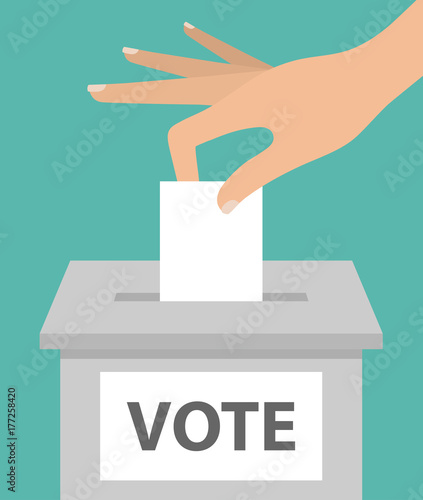 Voting concept. Woman's hand putting paper in the ballot box