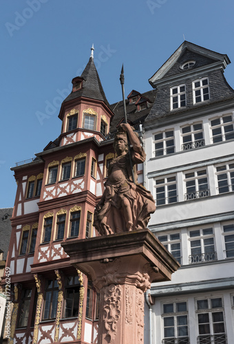 the minervabrunnen in front of the half-timbered houses on Roemerberg in Frankfurt, Germany