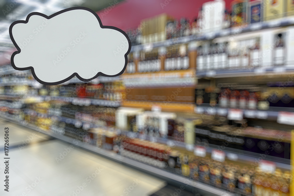 Alcohol department in the supermarket. Defocused image. Place for your text.