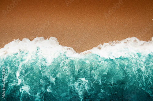 Wave Of Teal Ocean On Sandy Beach photo