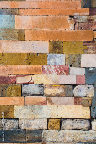 Old weathered stone tiles wall vintage background