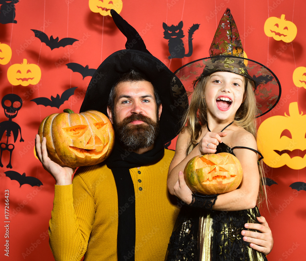 Fototapeta premium Girl and bearded man with happy faces on red background