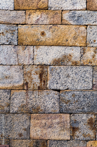 Old weathered stone tiles wall vintage background