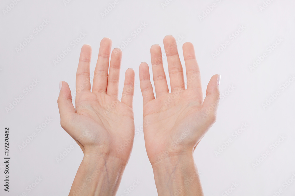 Beautiful and healthy woman's hands isolated on white background. Open hands for posting product. Macro human palms. Mock up and copy space. Dermatology Beautiful and healthy woman's hands isolated on white background. Open hands for posting product. Macro human palms. Mock up and copy space. Dermatology