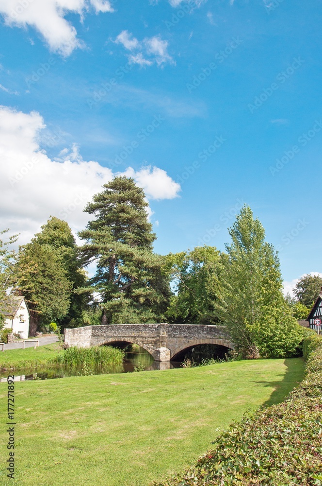 The old bridge in the village of Eardisland, Herefordshire, United Kingdom in the summertime.
