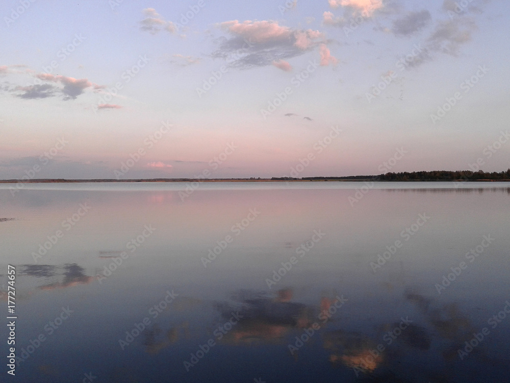 Calm lake at sunset. Relaxing landscape