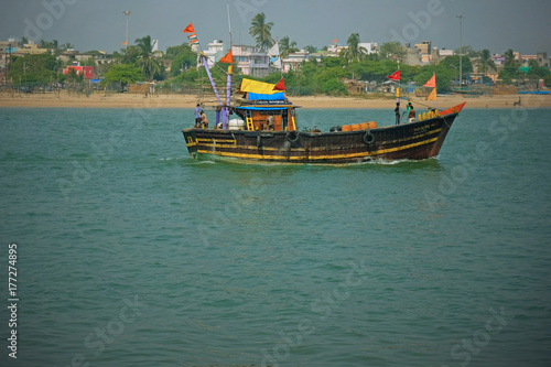 Boat setting out from Diu in India for nearby fishing grounds in the Arabian Sea. Fishing is a mainstay of the local economy of Diu Island in Gujarat state